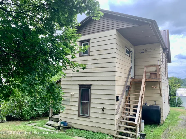a view of yard with outdoor seating
