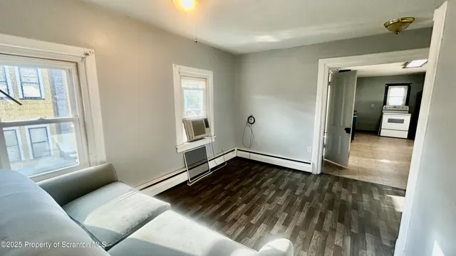 a view of an empty room with a window