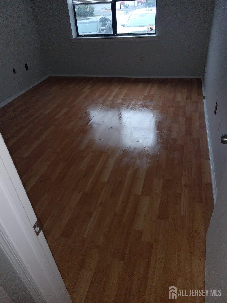 1503 Raspberry Court Edison, NJ 08817 - Photo 3 of 9 a view of a room has wooden floor and window