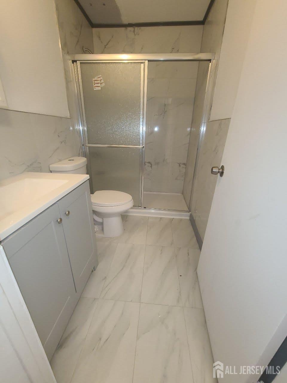 1503 Raspberry Court Edison, NJ 08817 - Photo 9 of 9 a bathroom with a granite countertop shower and a sink
