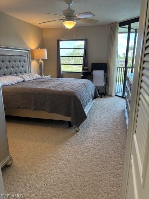 413 Augusta Boulevard, Unit 306 Naples, FL 34113 - Photo 11 of 31 a bedroom with a bed and window