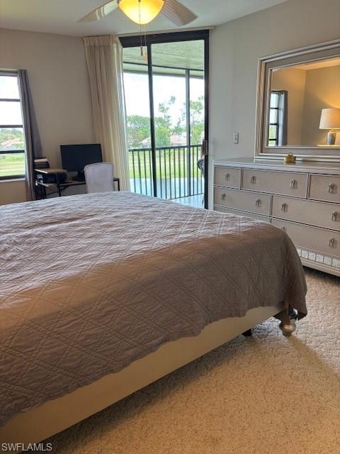 413 Augusta Boulevard, Unit 306 Naples, FL 34113 - Photo 12 of 31 a bedroom with a bed and a window