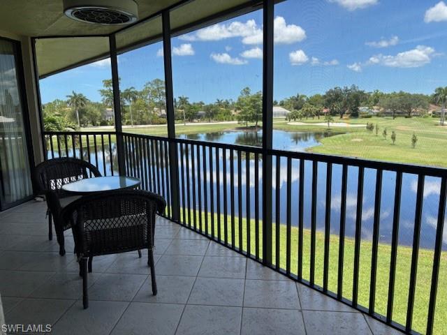 413 Augusta Boulevard, Unit 306 Naples, FL 34113 - Photo 25 of 31 a view of a porch with furniture and a yard