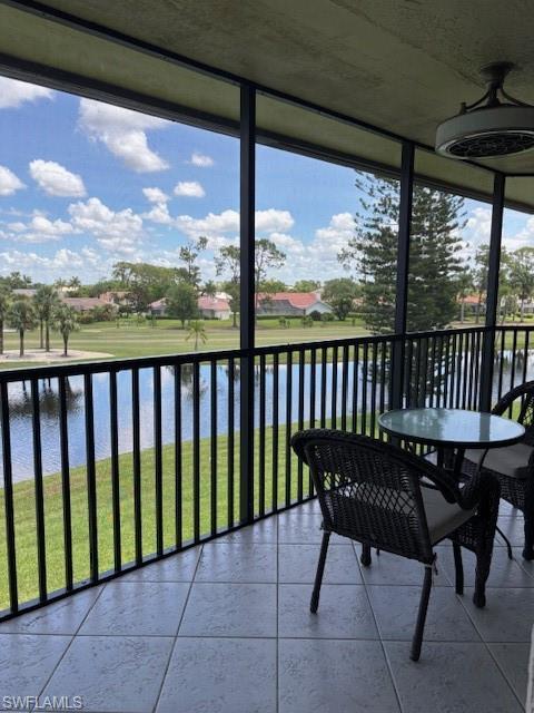 413 Augusta Boulevard, Unit 306 Naples, FL 34113 - Photo 26 of 31 a view of a chairs and table in the balcony