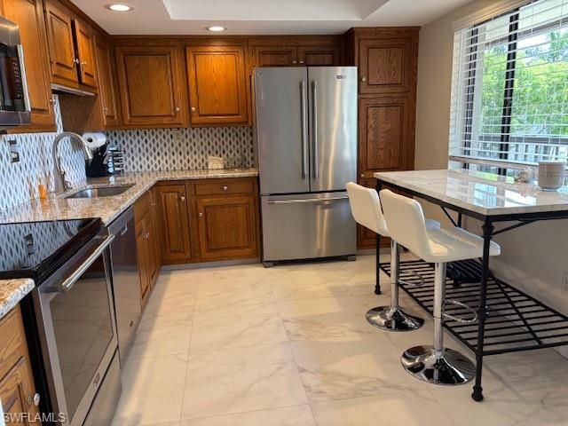 413 Augusta Boulevard, Unit 306 Naples, FL 34113 - Photo 5 of 31 a kitchen with sink cabinets and appliances