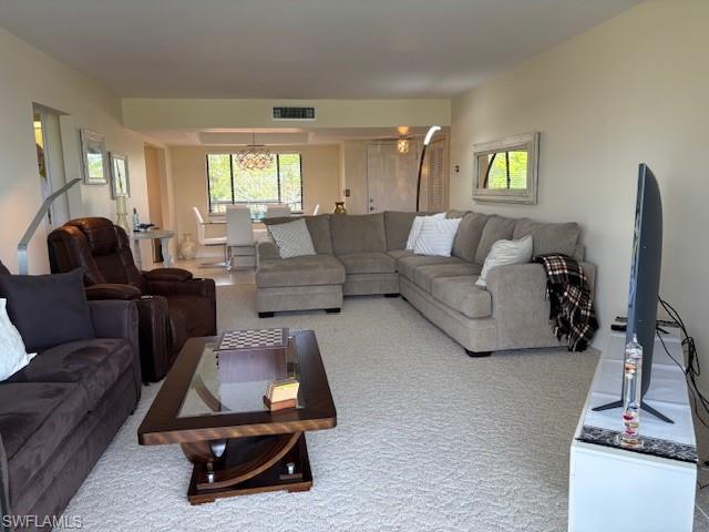 413 Augusta Boulevard, Unit 306 Naples, FL 34113 - Photo 7 of 31 a living room with furniture gym equipment and a window