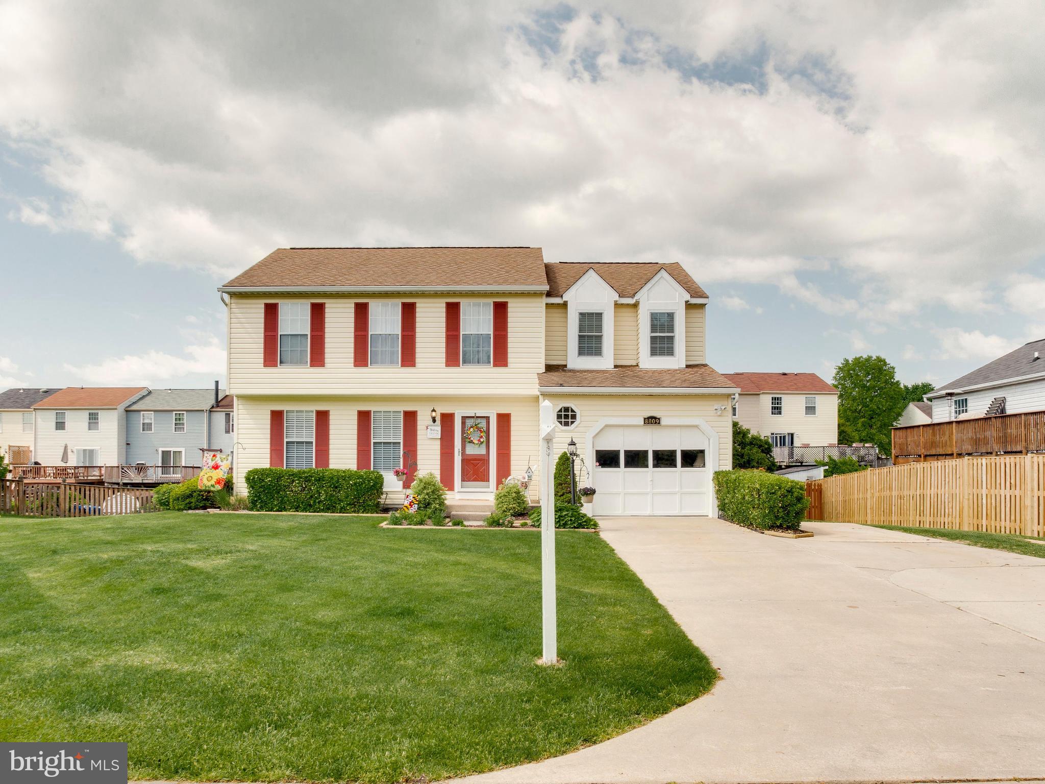 Amazing front yard, large garage and driveway!