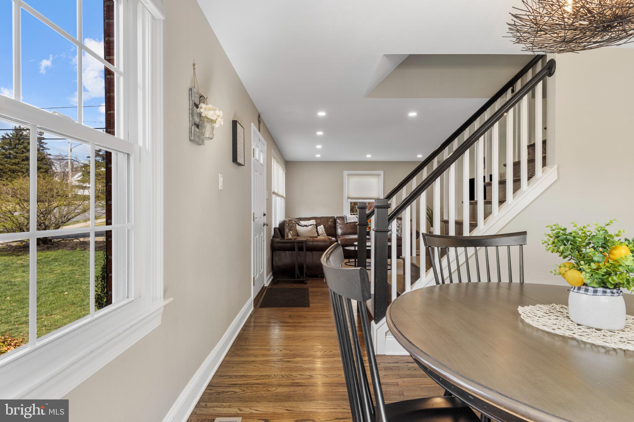 409 Paddock Road Havertown, PA 19083 - Photo 11 of 47 a dining room with wooden floor and stairs