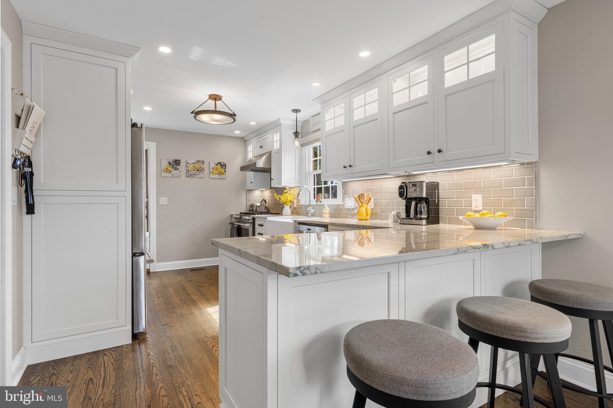 409 Paddock Road Havertown, PA 19083 - Photo 23 of 47 a kitchen with stainless steel appliances granite countertop a sink and a refrigerator
