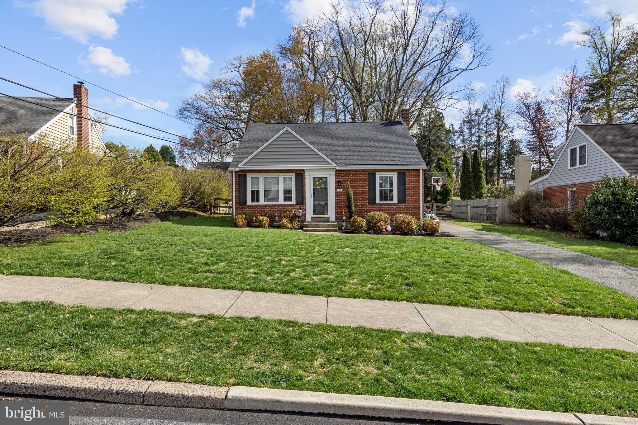 409 Paddock Road Havertown, PA 19083 - Photo 3 of 47 a front view of a house with a yard