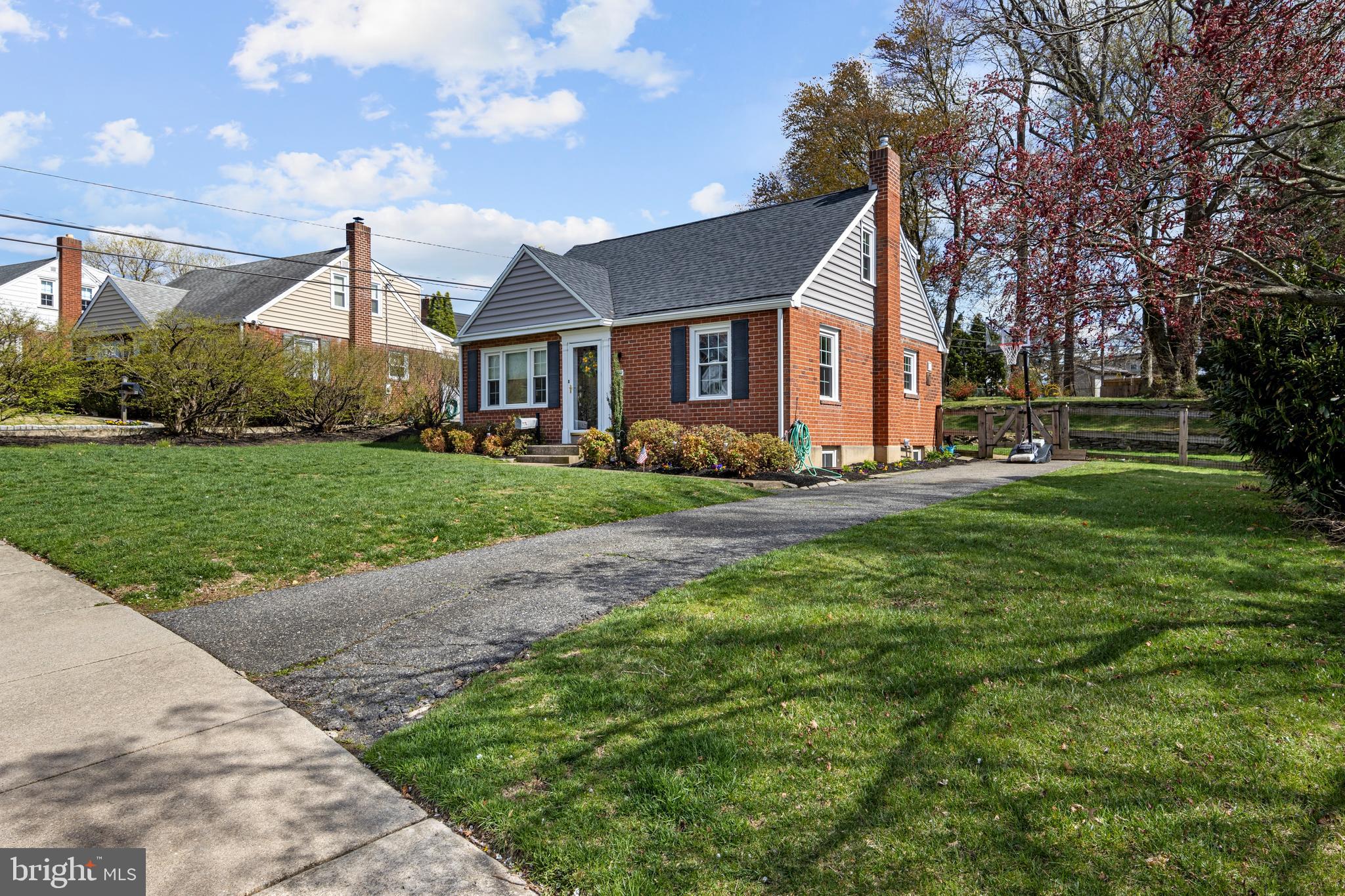 409 Paddock Road Havertown, PA 19083 - Photo 4 of 47 a front view of house with yard and green space