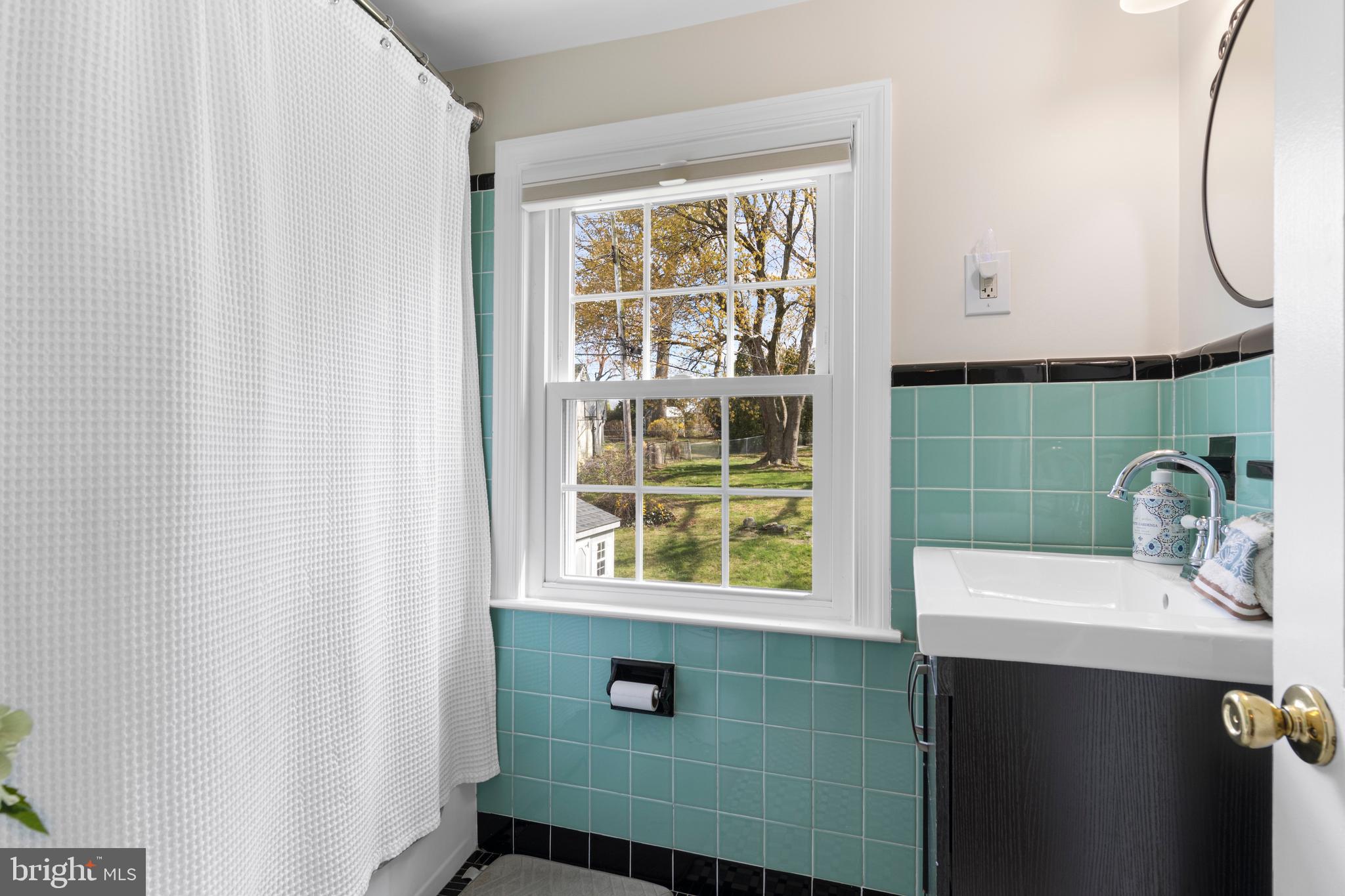 409 Paddock Road Havertown, PA 19083 - Photo 41 of 47 a bathroom with a sink and a mirror