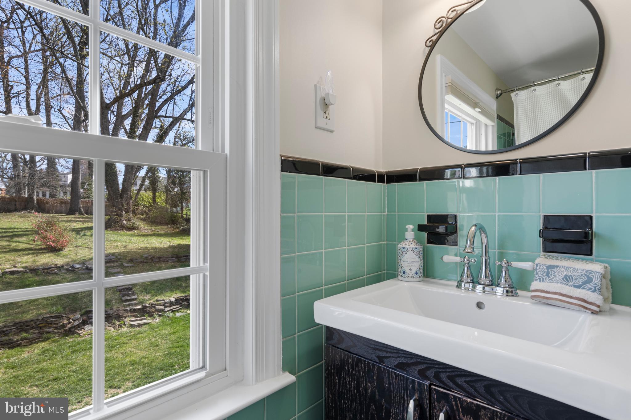 409 Paddock Road Havertown, PA 19083 - Photo 42 of 47 a bathroom with a sink and a mirror