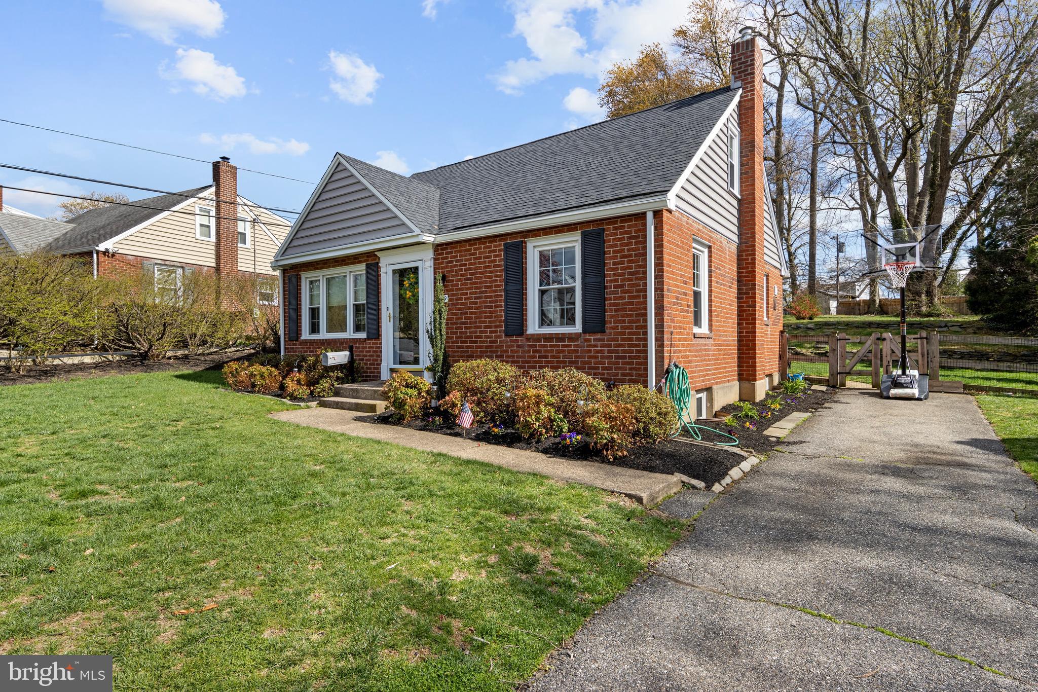 409 Paddock Road Havertown, PA 19083 - Photo 6 of 47 a front view of house with yard and outdoor seating