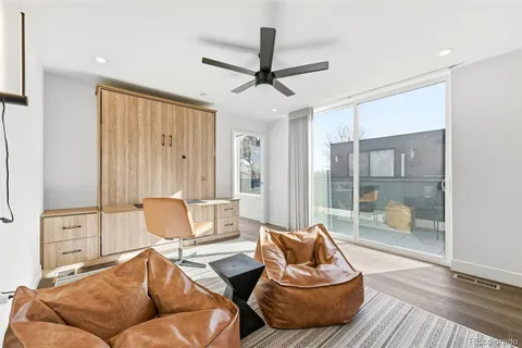 a living room with furniture and a rug