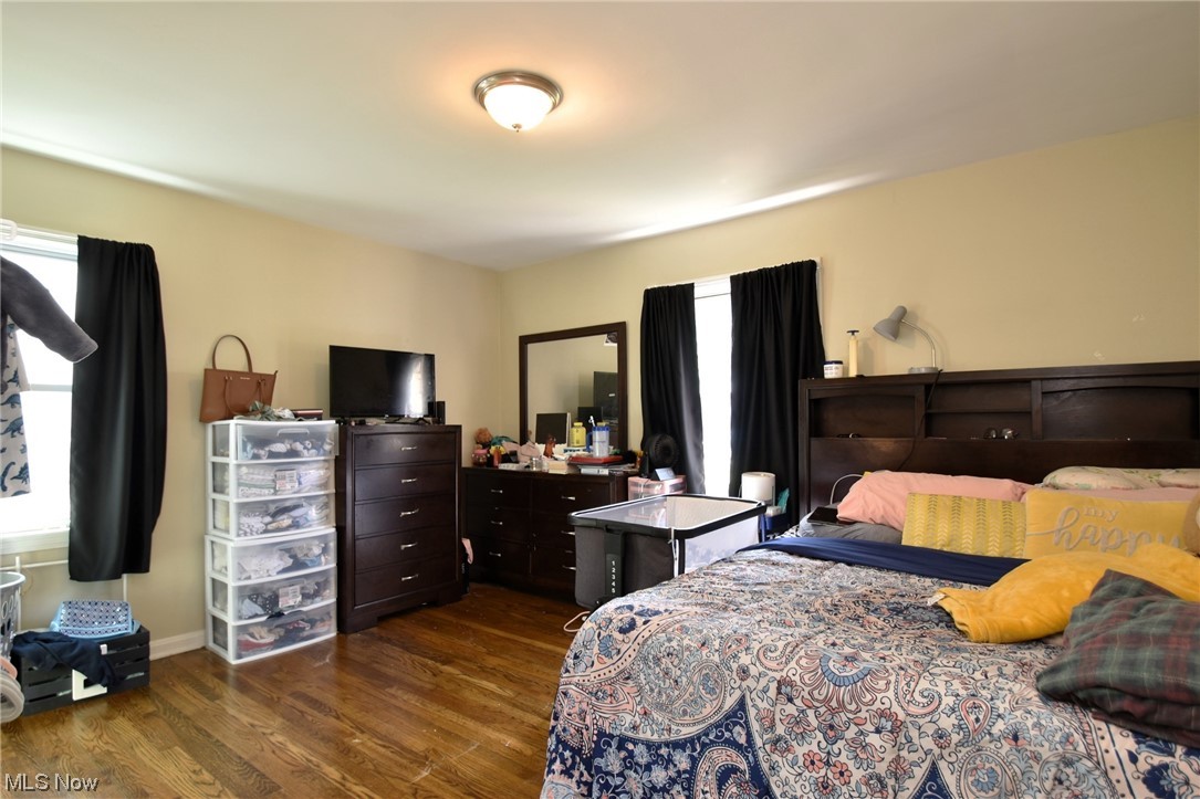 4205 Okalona Road South Euclid, OH 44121 - Photo 11 of 21 Bedroom featuring dark hardwood flooring.
