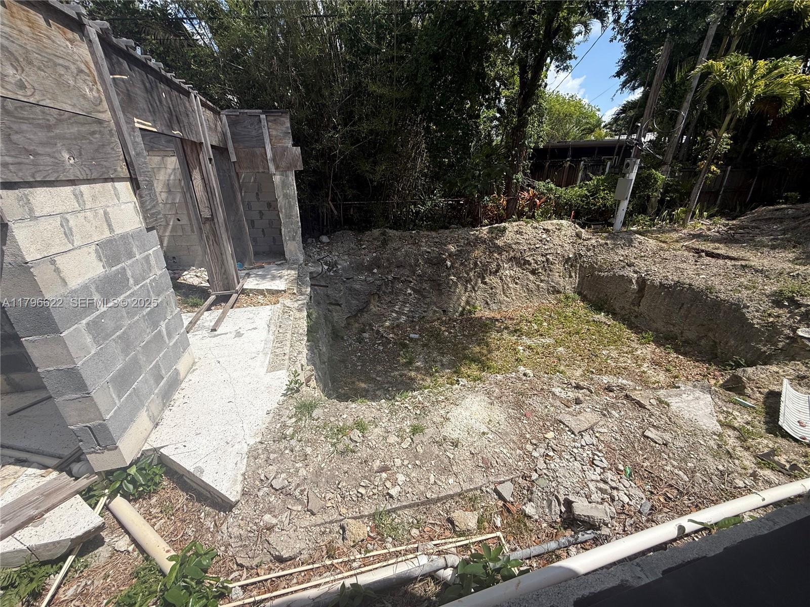 751 Northeast 70th Street Miami, FL 33138 - Photo 14 of 25 a view of a backyard of the house