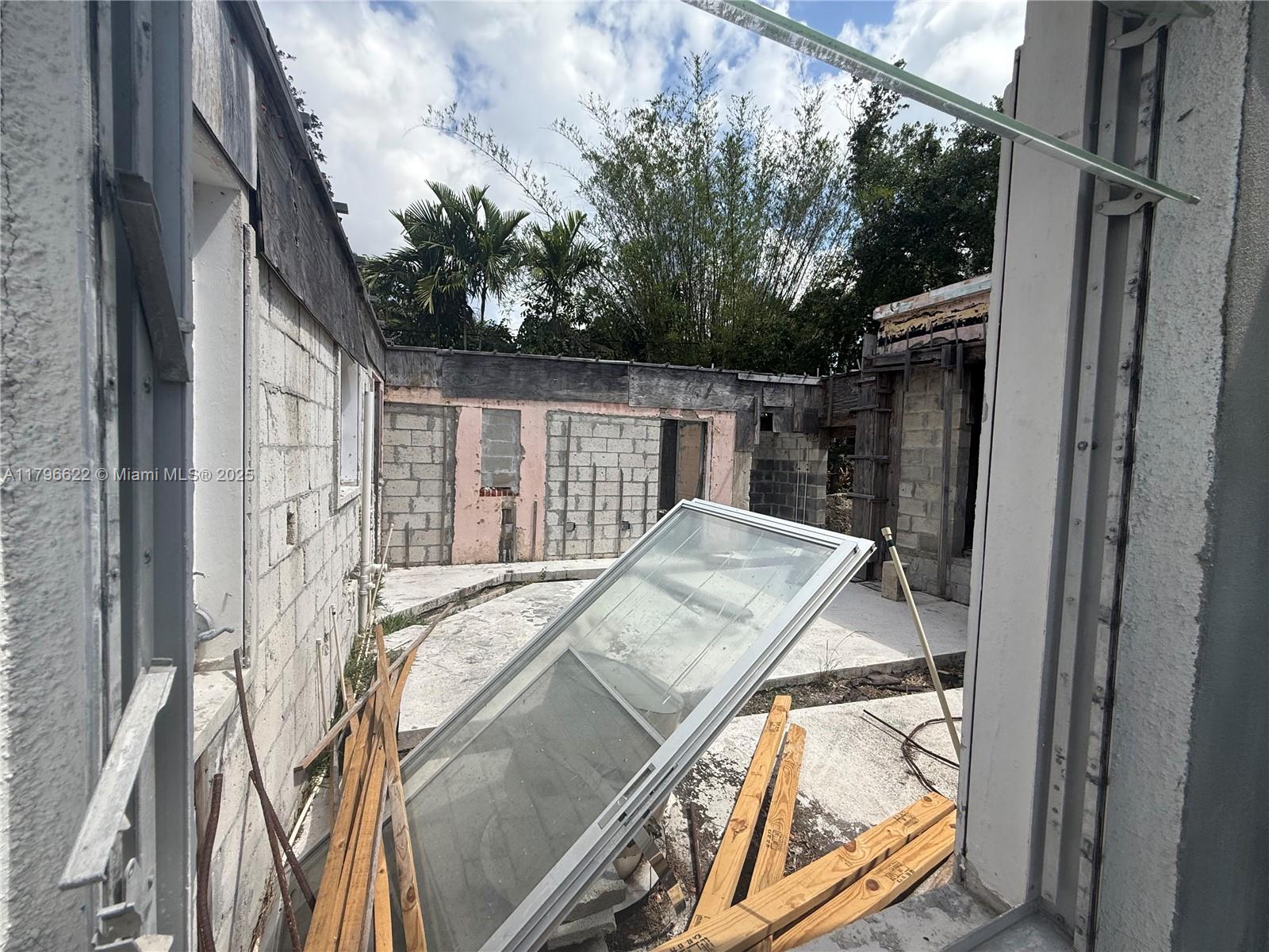 751 Northeast 70th Street Miami, FL 33138 - Photo 19 of 25 a bed sitting in a balcony next to a yard