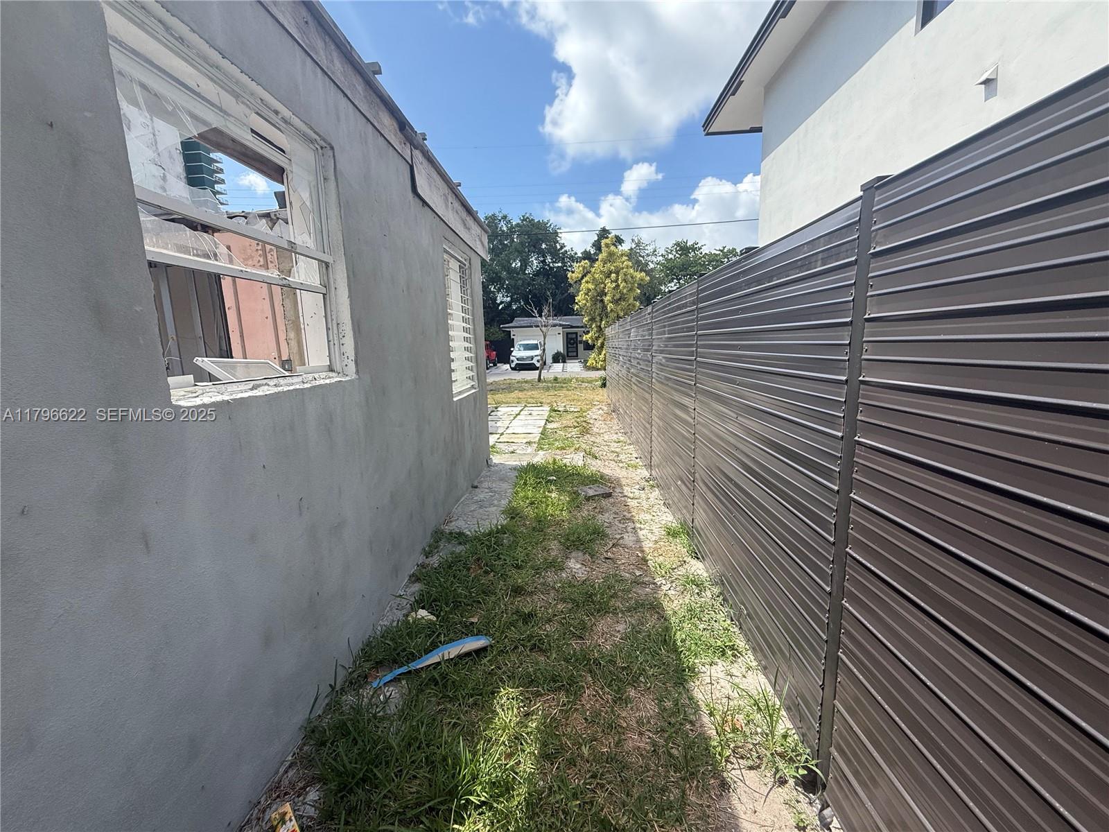 751 Northeast 70th Street Miami, FL 33138 - Photo 22 of 25 a view of backyard of house