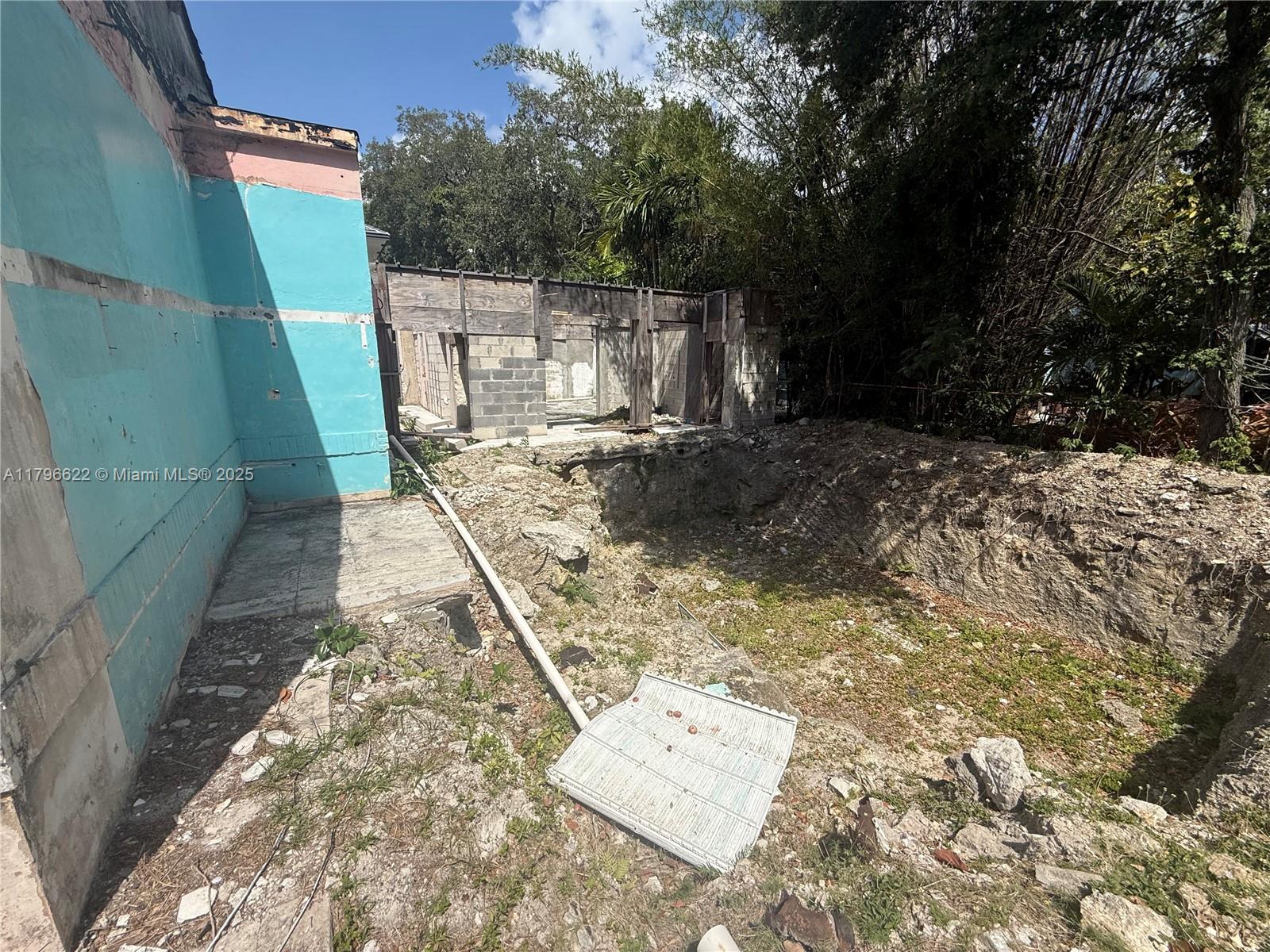 751 Northeast 70th Street Miami, FL 33138 - Photo 23 of 25 a view of a yard with wooden fence