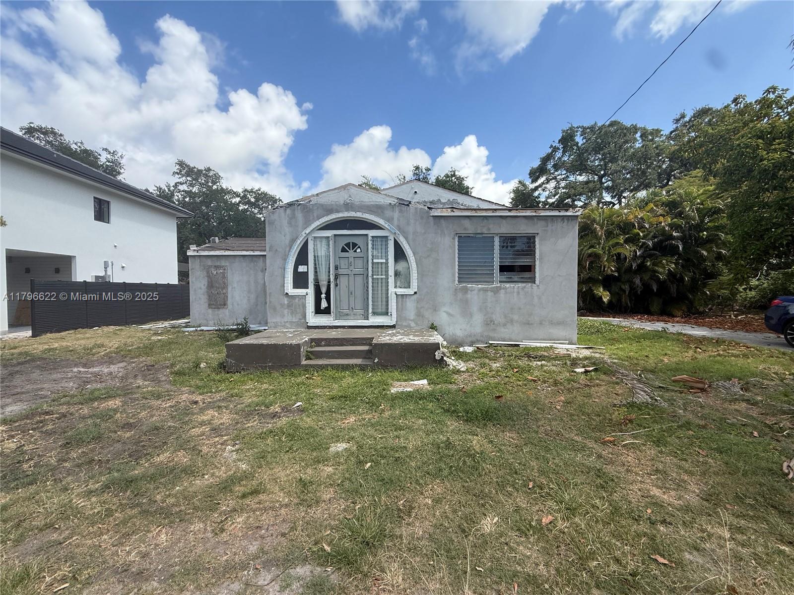 751 Northeast 70th Street Miami, FL 33138 - Photo 25 of 25 a front view of a house with garden