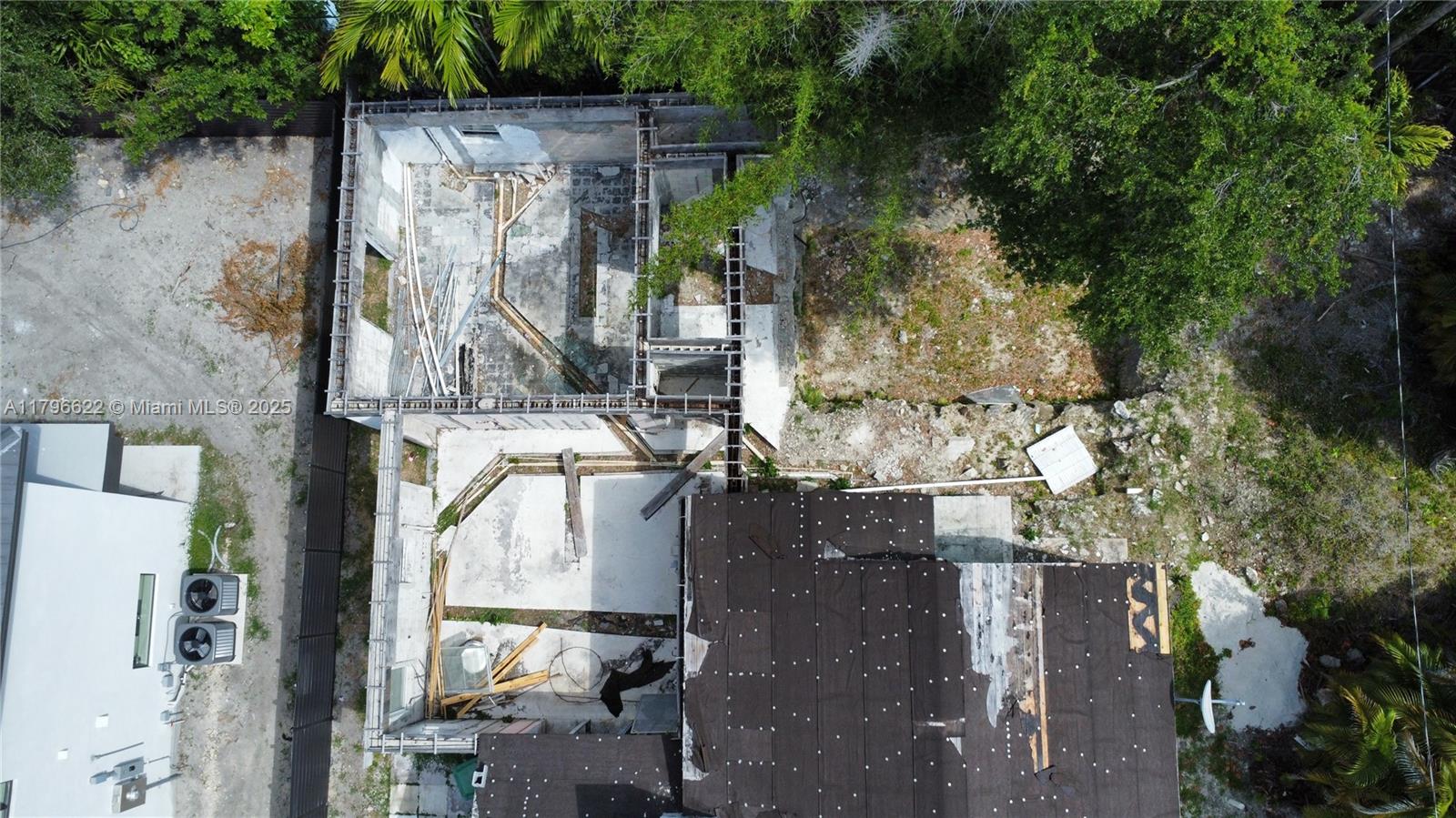 751 Northeast 70th Street Miami, FL 33138 - Photo 3 of 25 a buildings covered with tall trees
