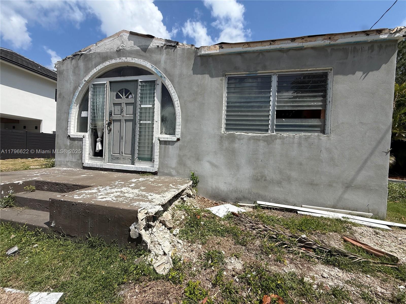 751 Northeast 70th Street Miami, FL 33138 - Photo 10 of 25 a front view of a house