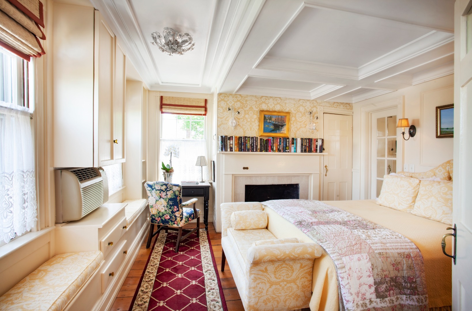 10 B Cliff Road Nantucket, MA 02554 - Photo 11 of 19 a bed room with a bed and a fireplace