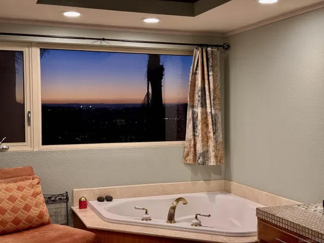 a bathroom with a tub and a shower