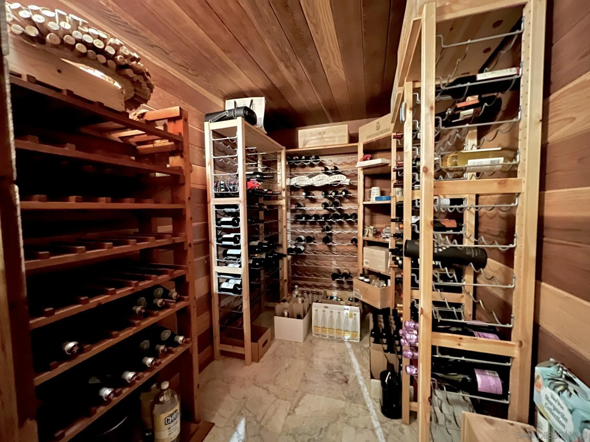 5346 Grandridge Road El Cajon, CA 92020 - Photo 30 of 50 a view of walk in closet with clothes and shoes