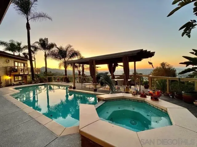 a view of a swimming pool with chairs