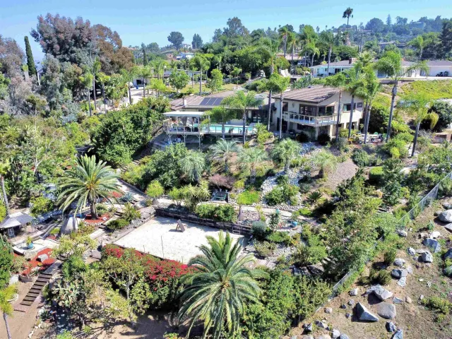 a terrace with outdoor seating and trees