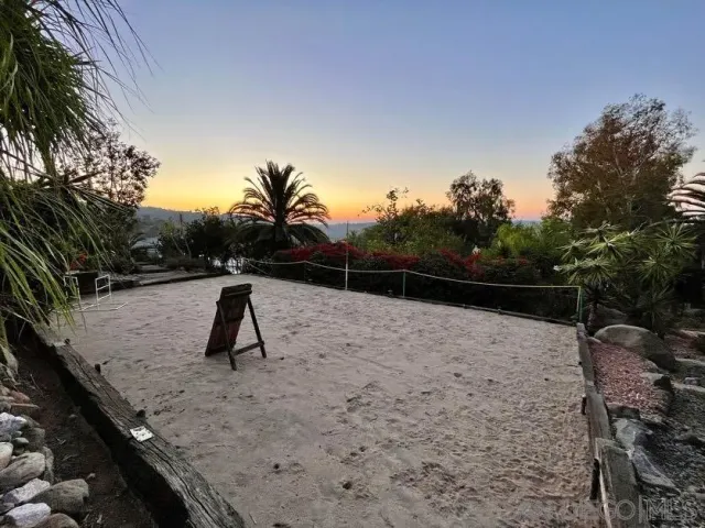 a view of house with a yard