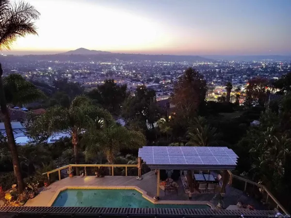 a view of a chairs and table in patio