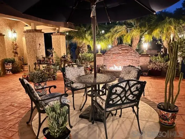 a view of an outdoor dining space with swimming pool