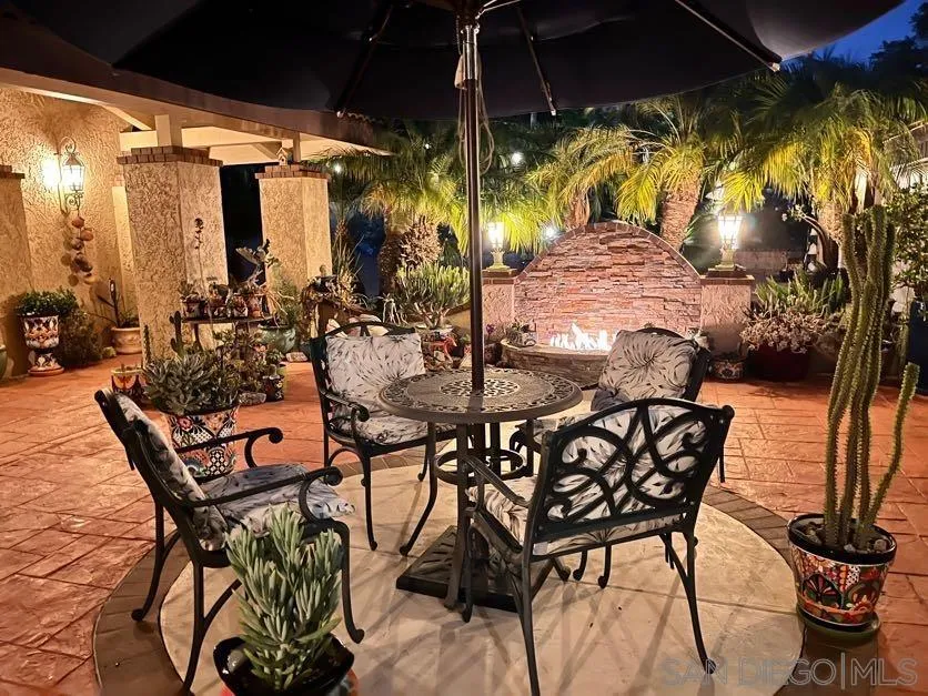 5346 Grandridge Road El Cajon, CA 92020 - Photo 8 of 50 a view of an outdoor dining space with swimming pool