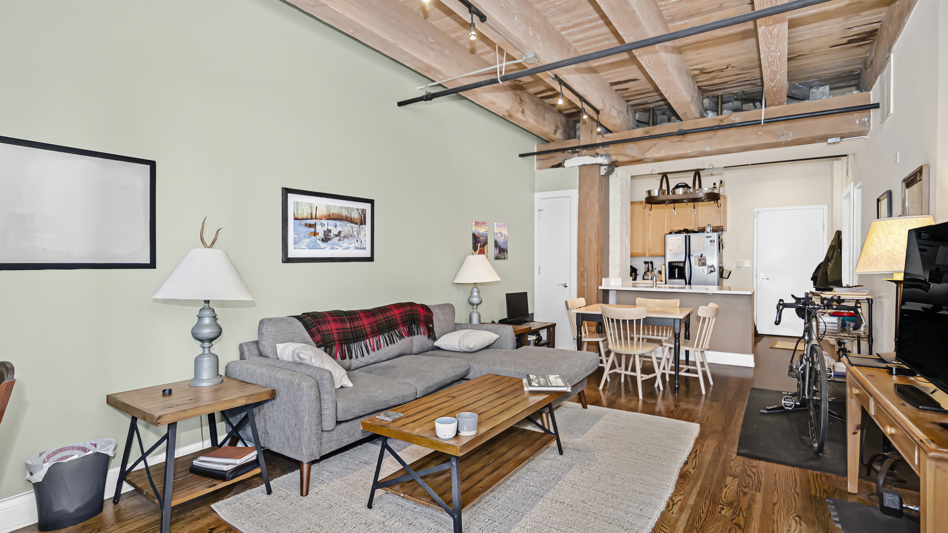 106 North Aberdeen Street, Unit 4G Chicago, IL 60607 - Photo 3 of 22 a living room with furniture a flat screen tv and a table