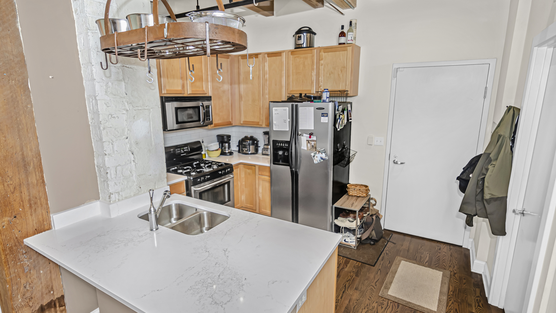 106 North Aberdeen Street, Unit 4G Chicago, IL 60607 - Photo 7 of 22 a view of a kitchen with appliances and cabinets