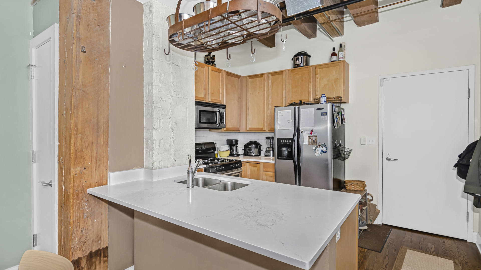 106 North Aberdeen Street, Unit 4G Chicago, IL 60607 - Photo 8 of 22 a kitchen with stainless steel appliances granite countertop a sink a refrigerator and a stove