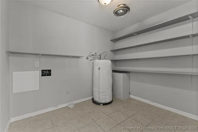 a view of room with window and ceiling fan