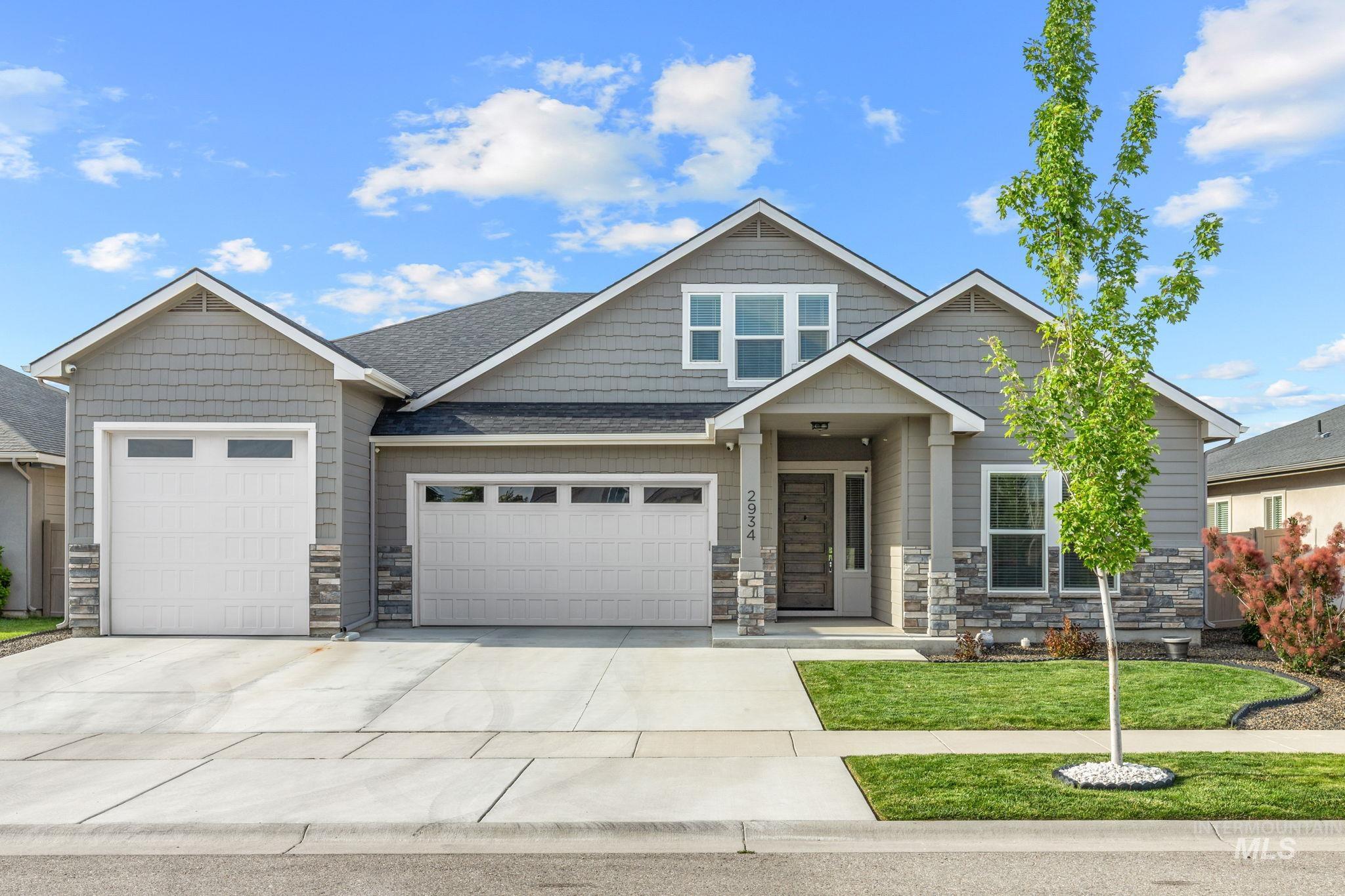 2934 East Murchison Street Meridian, ID 83642 - Photo 1 of 44 Contemporary single-story residence featuring a gray shingle and stone veneer exterior