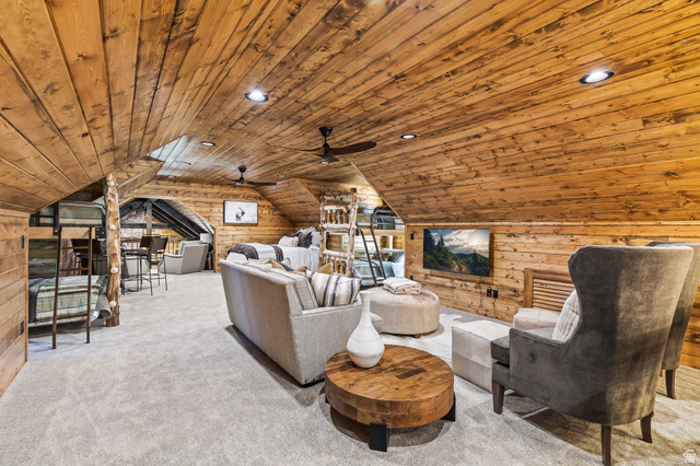 2031 South Quakie Road Koosharem, UT 84744 - Photo 27 of 33 Vaulted wood-paneled ceiling, recessed lighting, wood-paneled walls, built-in television, and carpeted flooring
