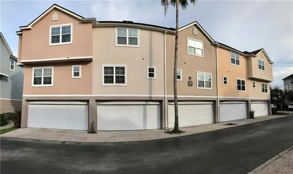 a front view of a house with a street