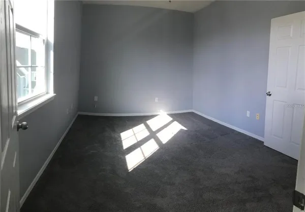 en empty room with windows