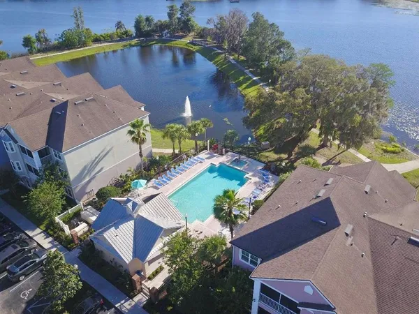 an aerial view of a house with a lake view