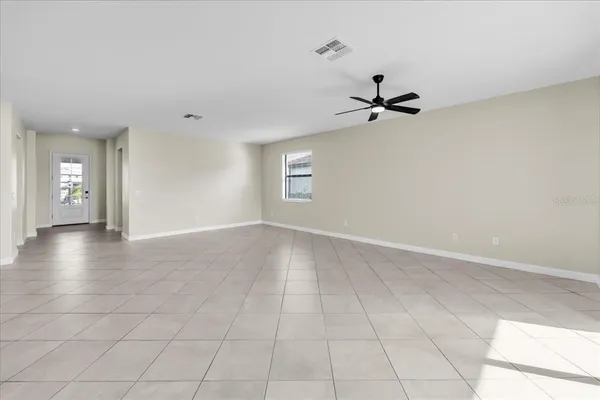 a kitchen with kitchen island granite countertop a sink a center island and stainless steel appliances