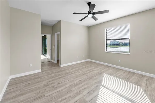 a view of a floor to ceiling window next to a yard