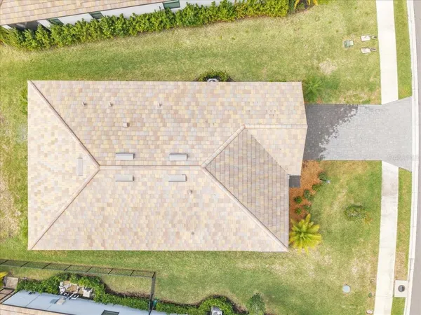 an aerial view of residential building and ocean