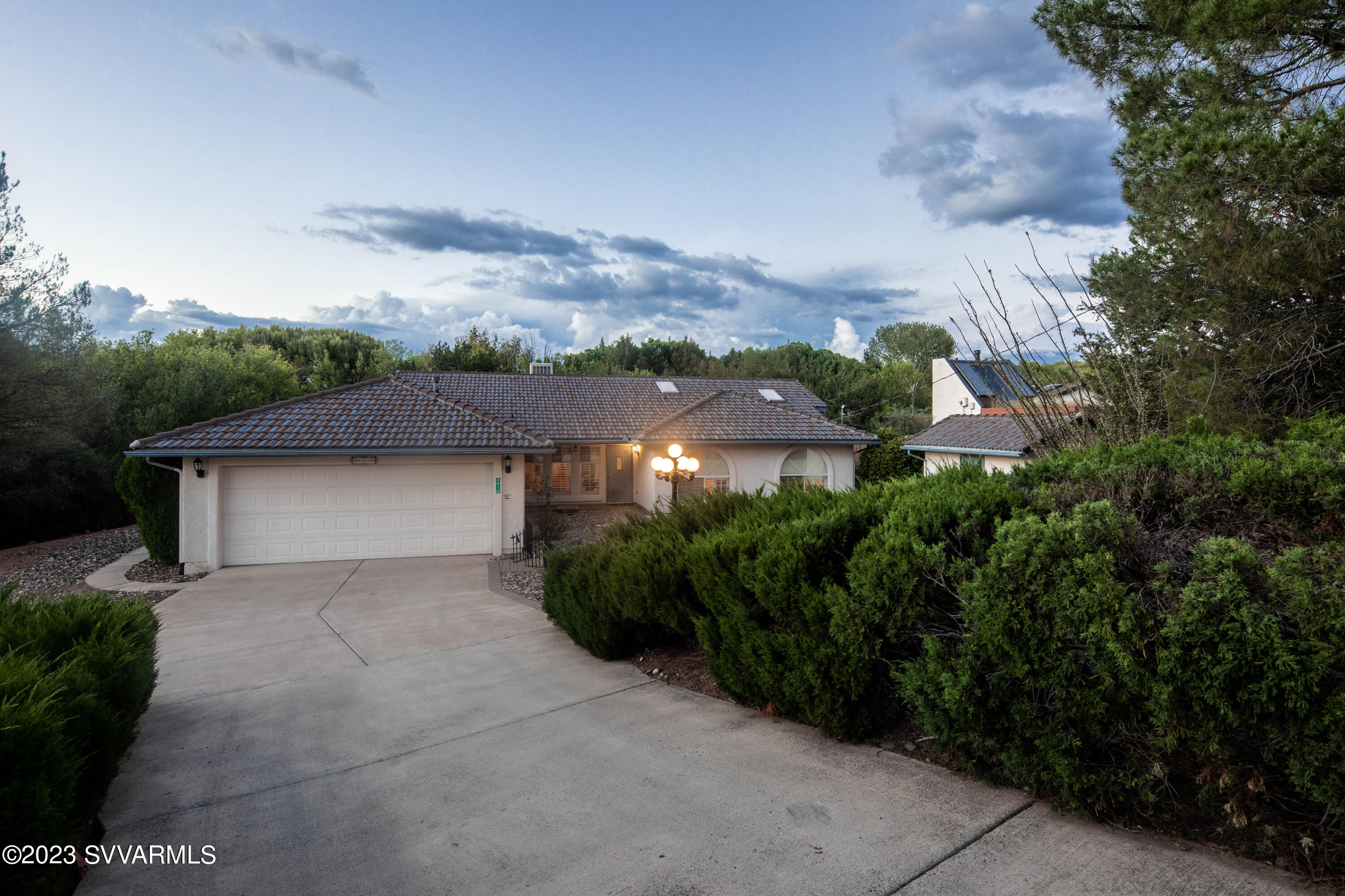 4710 Chipmunk Hollow Rimrock, AZ 86335 - Photo 3 of 37 a view of a house with a yard and garage