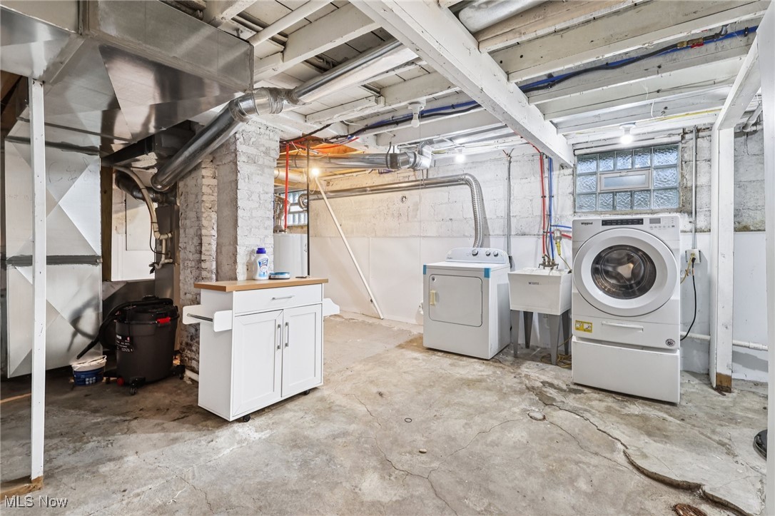 159 Eastland Road Berea, OH 44017 - Photo 28 of 38 Basement featuring separate washer and dryer and water heater